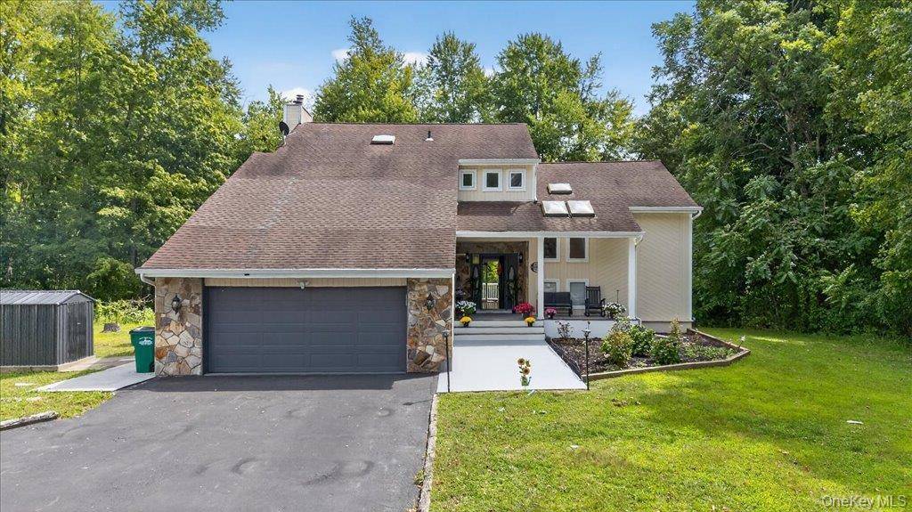 Welcome to this spacious 3 bedroom, 3 bathroom home in desirable Hopewell Junction, offering 2, 357 sq ft of living space on a full acre of land.