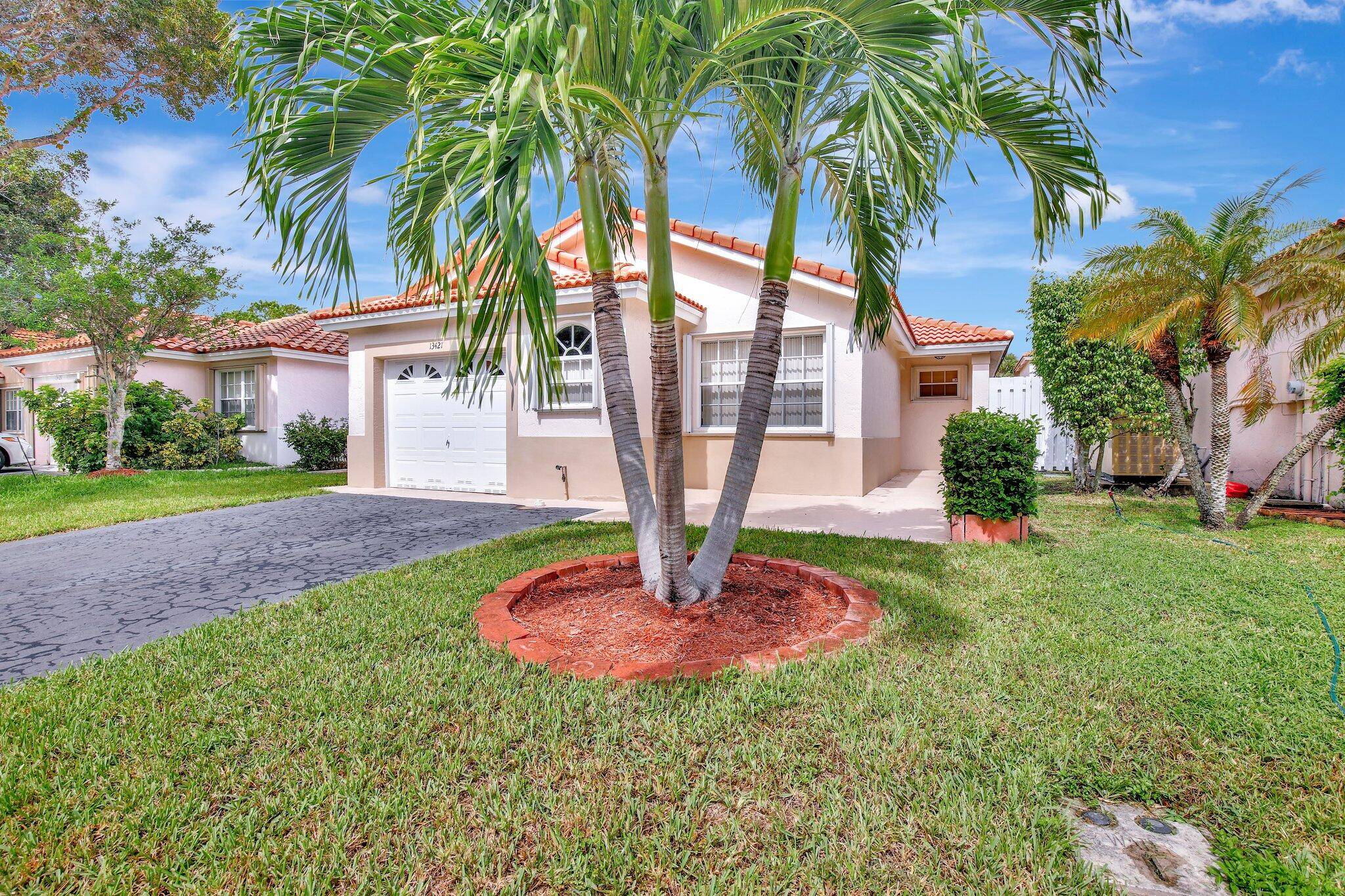 This meticulously maintained home offers bright and spacious living areas with large, light filled tile flooring throughout.