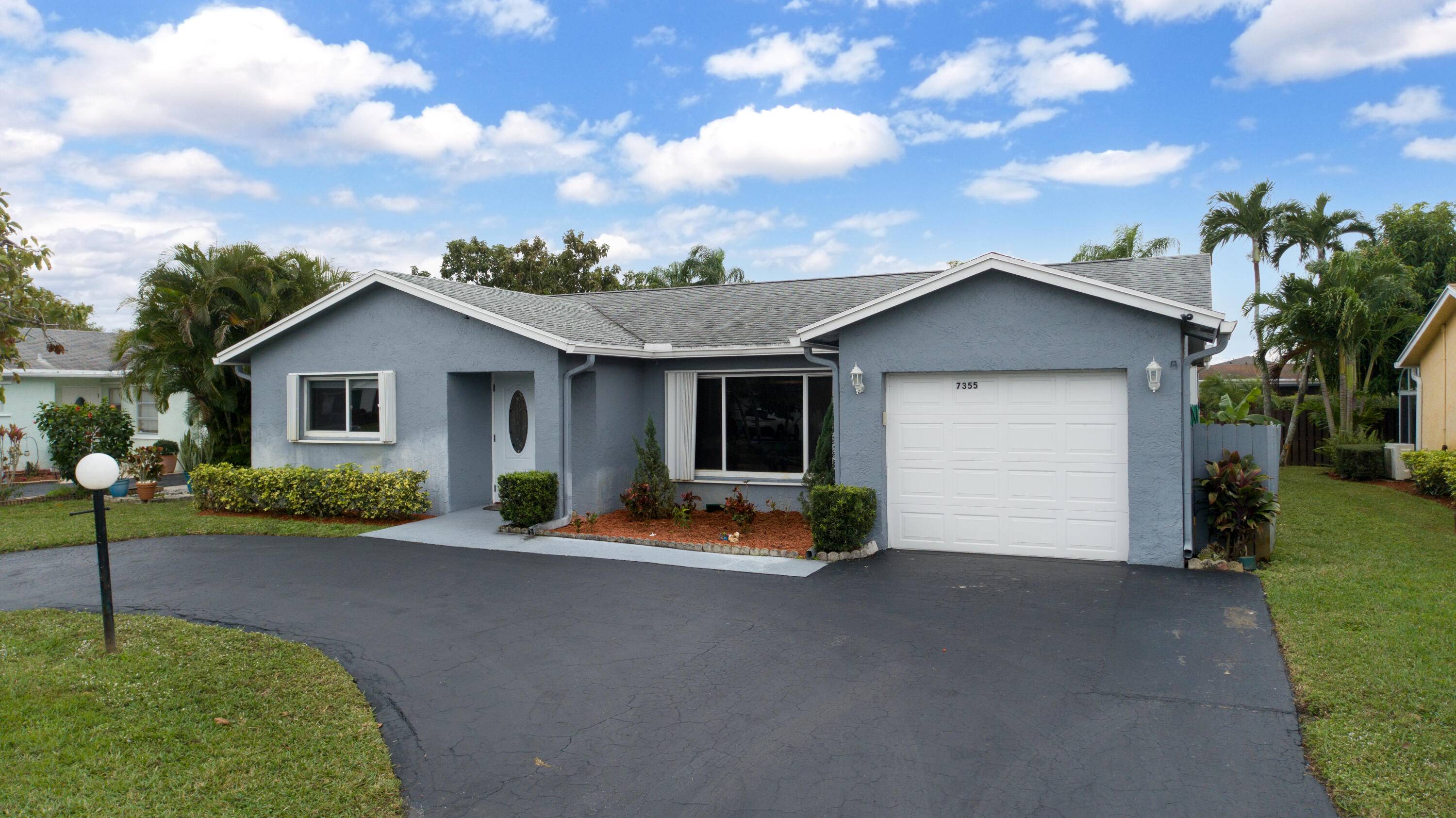 GORGEOUS, UPDATED, SKYLIGHTS, FANS, FRESHLY PAINTED, SCREENED PORCH, 1 CAR GARAGE AND CIRCULAR DRIVEWAY.