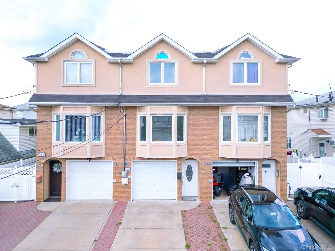 Welcome to this fully renovated, move in ready modern townhouse in the heart of Midland Beach.