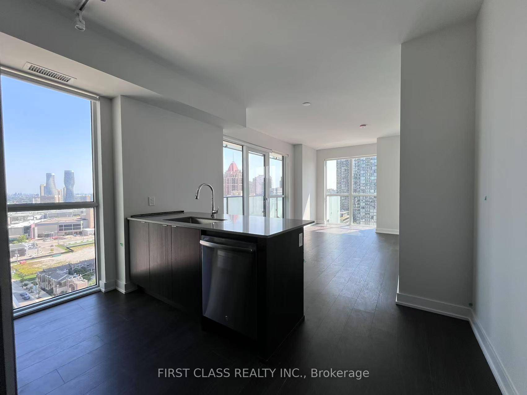 This unit boasts laminate floors throughout, along with quartz counters and high end built in stainless steel appliances in the kitchen.