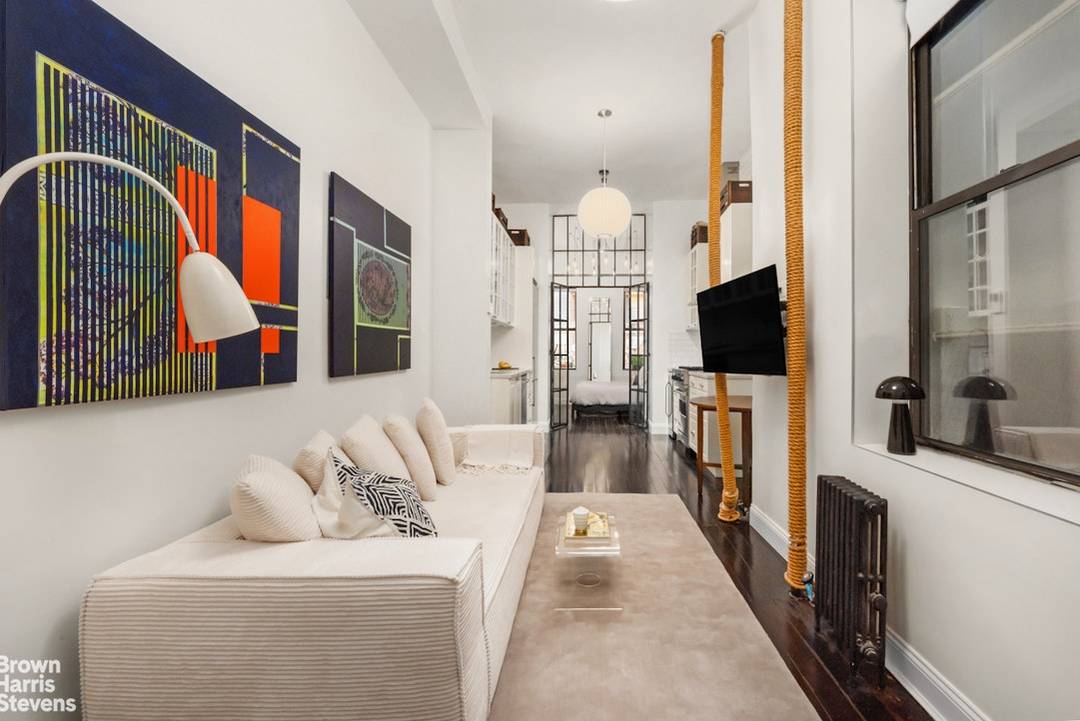 Hidden on a quiet, tree lined stretch of East 1st Street, this thoughtfully redesigned one bedroom offers a rare sense of calm right in the middle of the East Village.