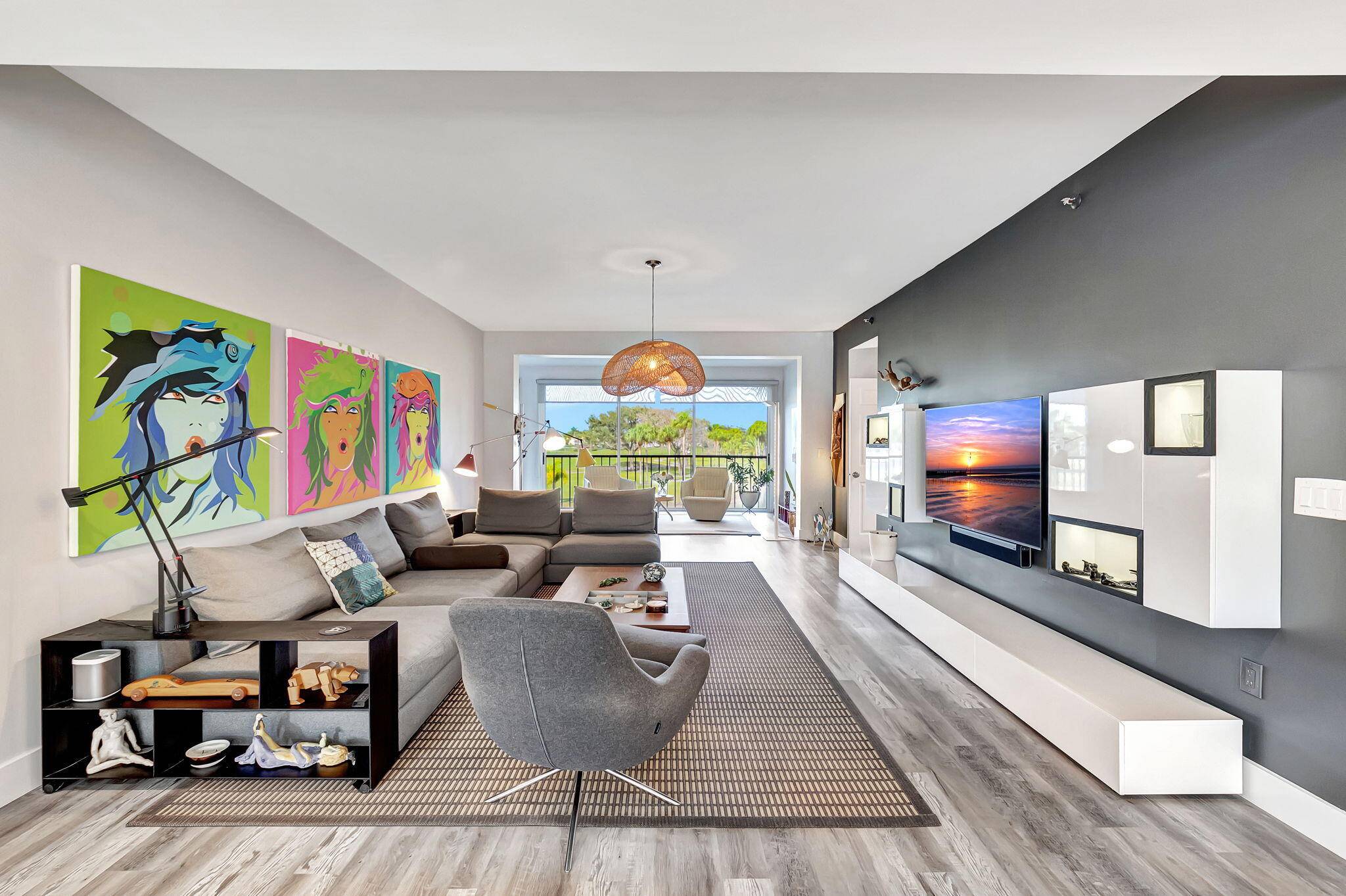 Golf where you live ! Stunning updated three bedroom residence boasting spectacular panoramic lake golf views.