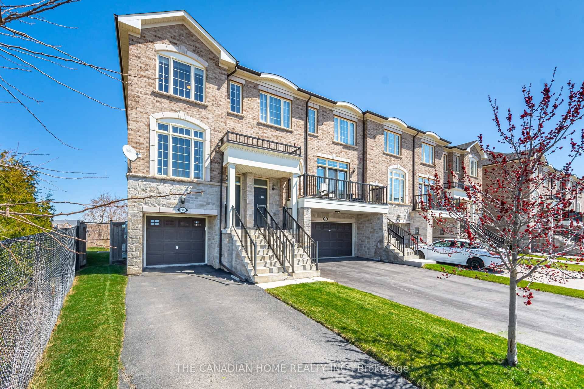 Rare end unit townhome with a walk out finished basement, on an oversized pie shaped lot in prestigious Westmount !