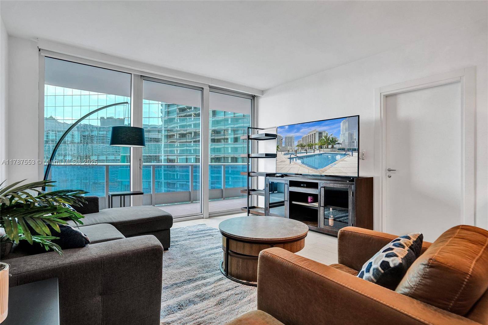 Step into refined elegance at Epic Residences with this stunning 1 bedroom, 1.