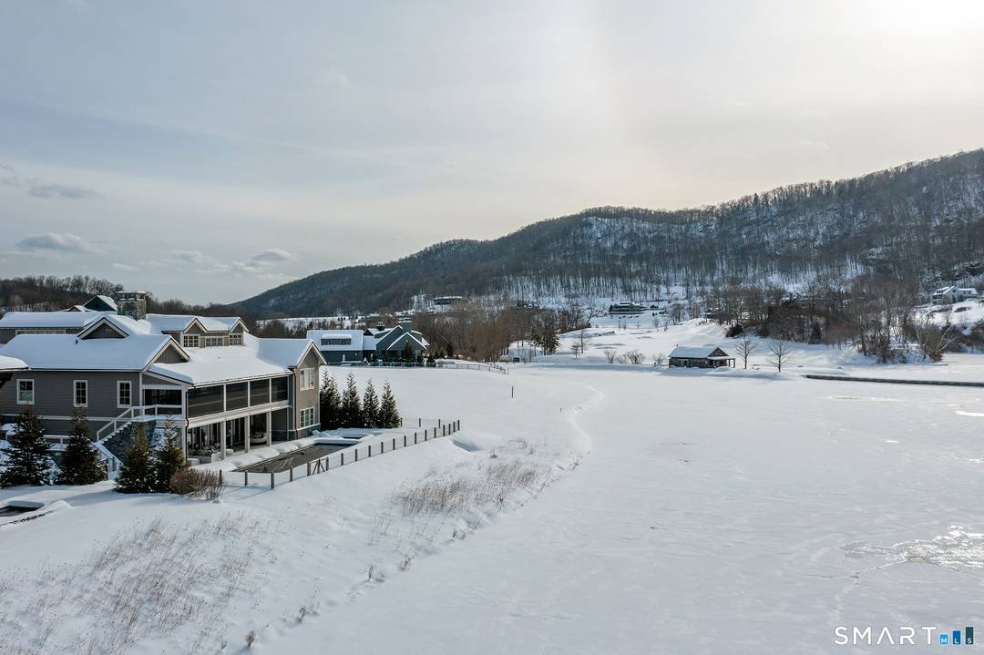 Refined Luxury. Rare Direct Lakefront Home within the Coveted Silo Ridge Community.