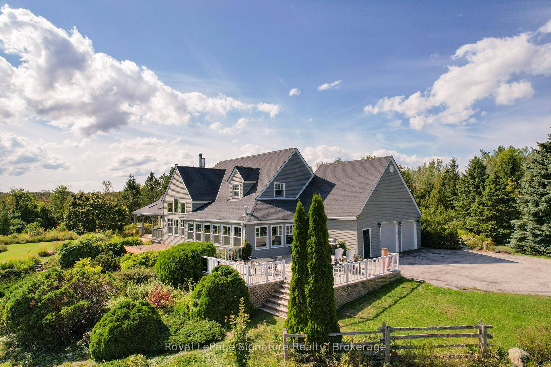 Perched on over 35 acres with panoramic views stretching across Georgian Bay and the escarpment, this stunning post and beam home offers over 5, 000 sq.