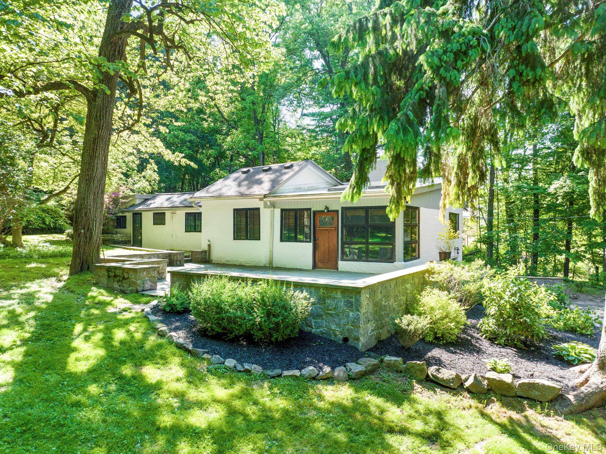 Welcome home to a true Mount Airy gem in the award winning Croton Harmon school district this elegant 1930 built home, nestled on 2.