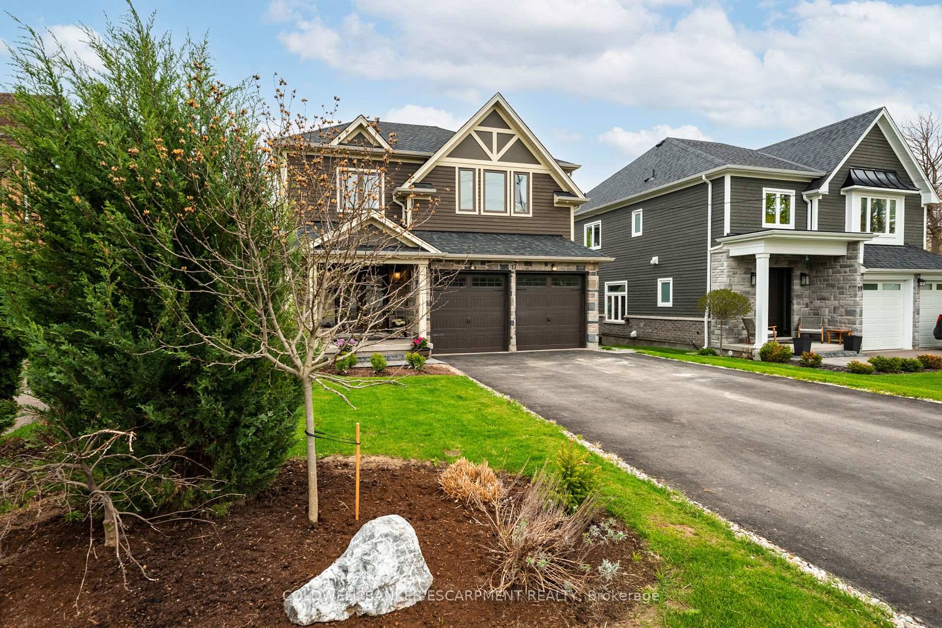 This stunning custom built home offers 4 spacious bedrooms and 5 baths, nestled on a deep ravine lot that backs onto a pristine conservation area, providing tranquility and privacy.