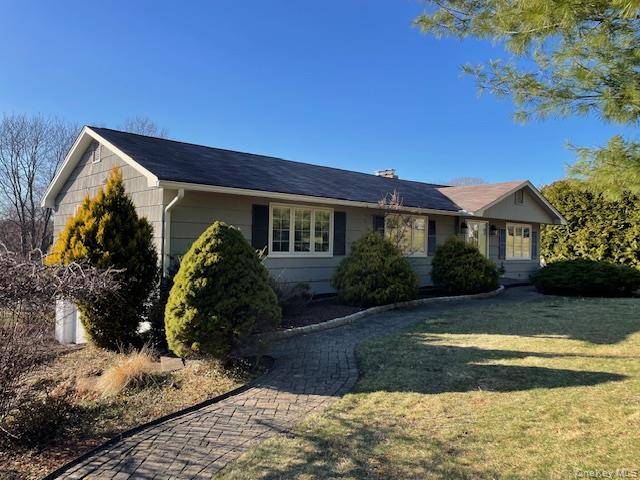 Beautifully maintained Ranch sits elevated on 0.