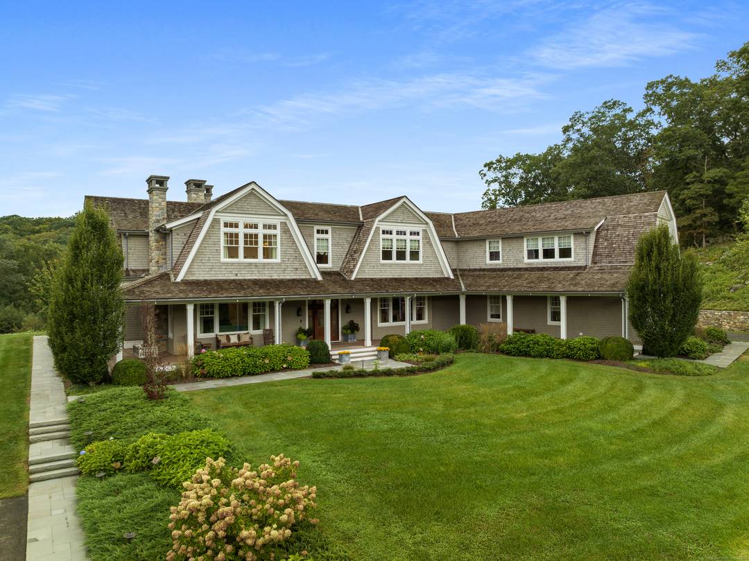 A rare offering, this Gambrel shingle style estate is a sanctuary on over 15 acres with a lake and separate building lot ideal for equestrian pursuits or a secluded retreat.