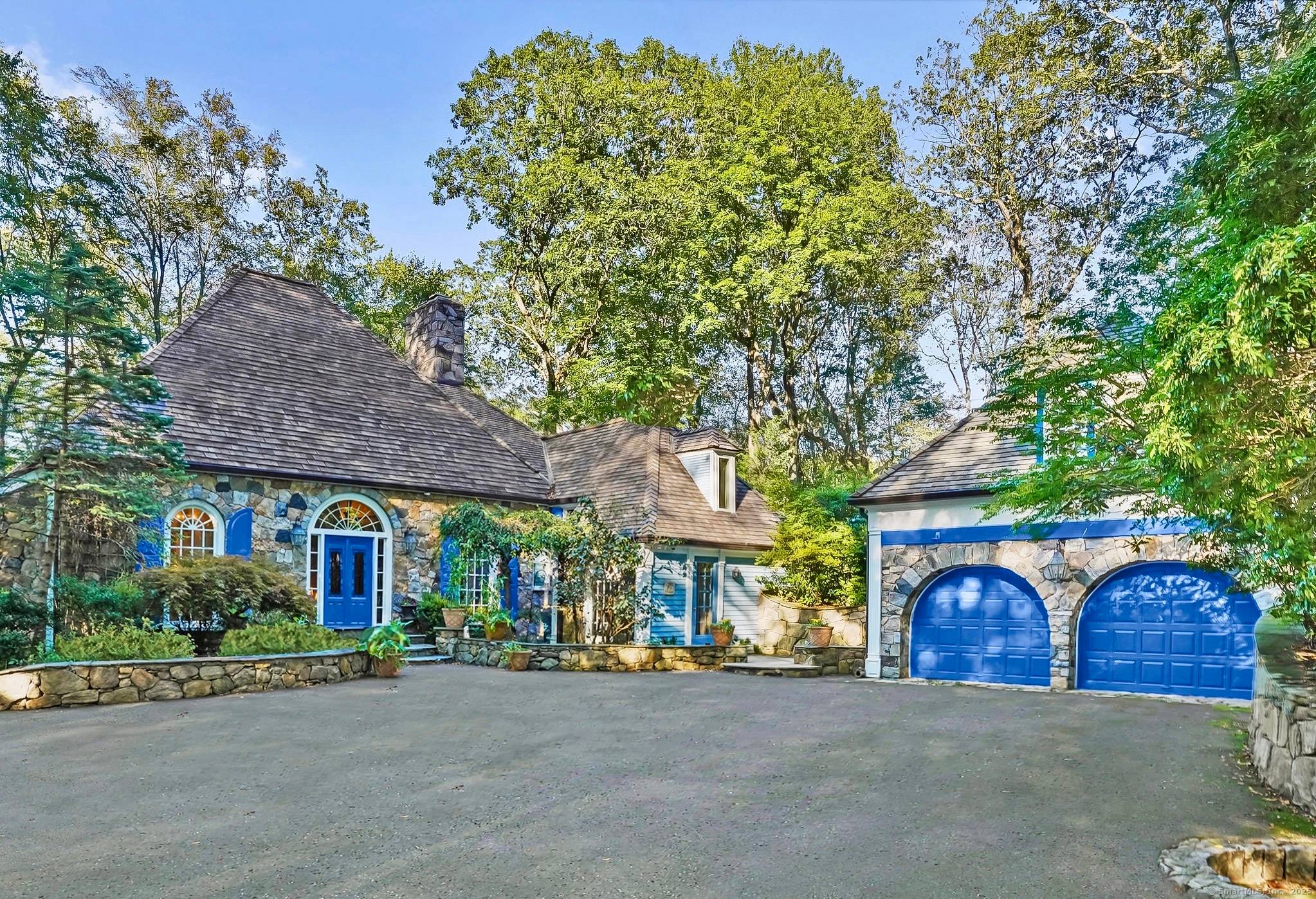 Nestled in the rolling hills of North Stamford, this celebrity French Country Colonial is a masterpiece of artistry and history.