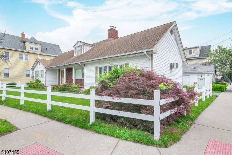 Exceptional Two Family Home with Updated Systems Bonus 2, 800 Sq Ft Commercial Warehouse.