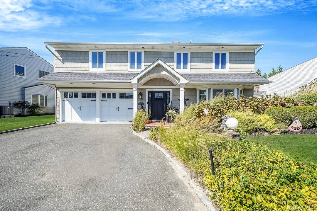 Located in the highly sought after Madison section of Oceanside, this four bedroom, two and a half bath home combines generous living spaces, refined finishes, and exceptional convenience.