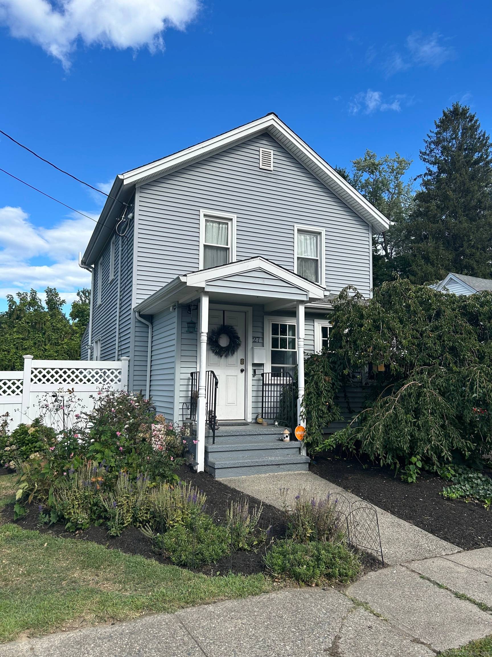 Welcome to 27 Peck Street with a charming front entry finished porch to enjoy reading or that morning cup of coffee.