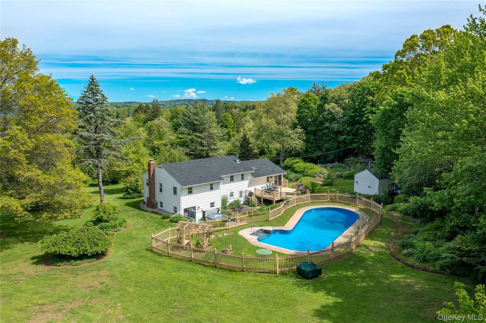 Set on 3. 62 acres of picturesque and private land, this expansive 4 bedroom split level home offers the perfect balance of spacious living and resort style outdoor amenities, highlighted ...