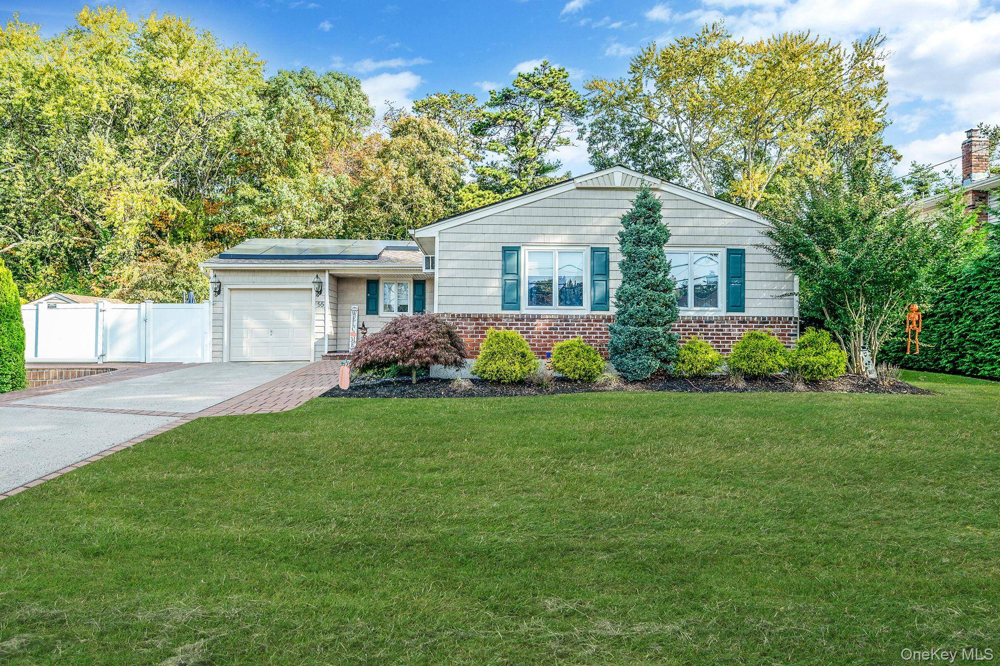 Welcome to this beautifully updated L shaped ranch featuring 3 bedrooms and 1.