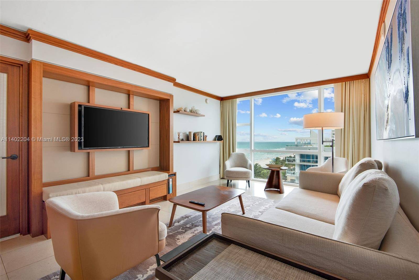 Ocean and beach view hotel suite turn key unit at Carillon Miami Wellness Resort, a premier oceanfront luxury property.