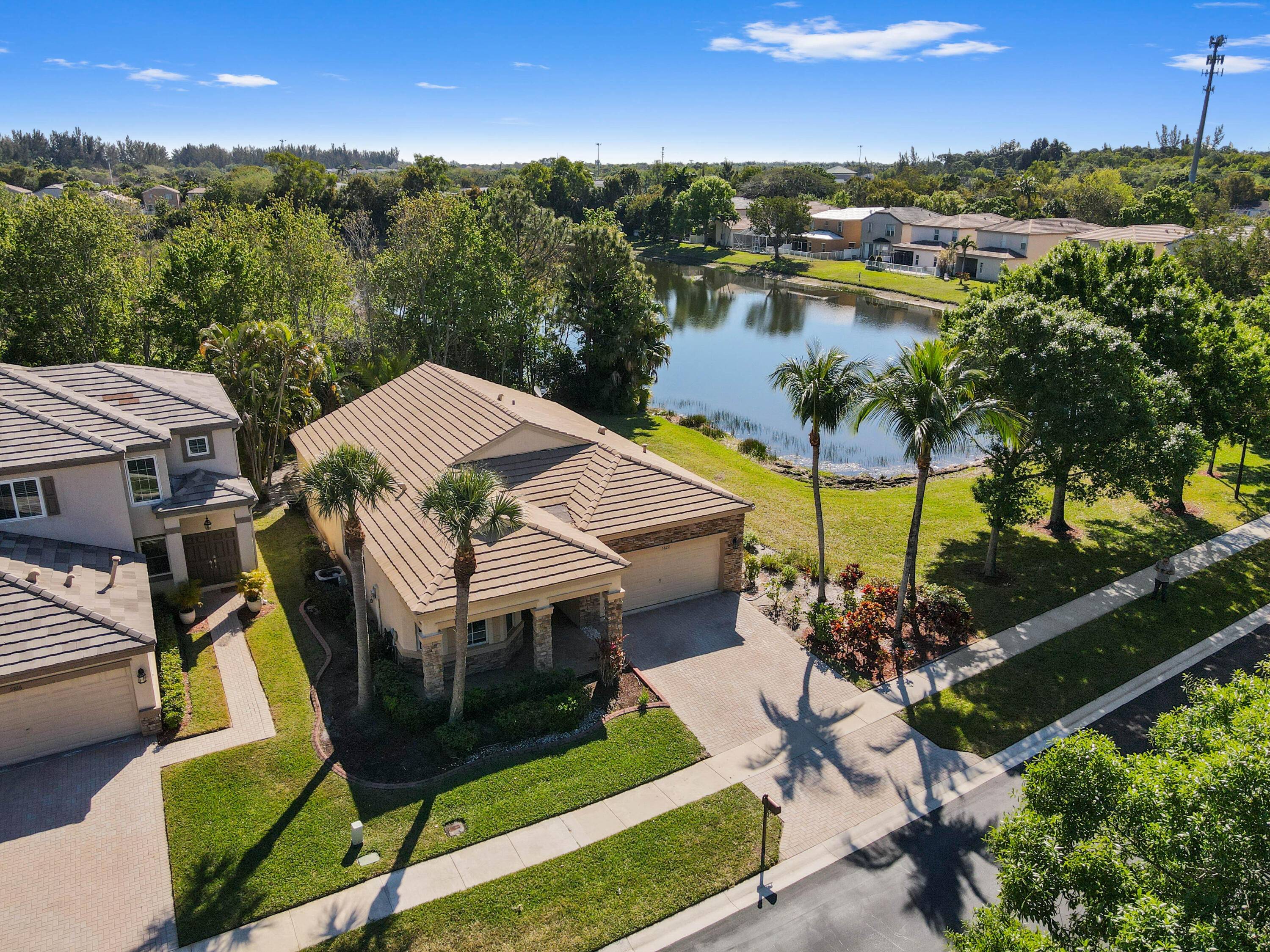 Discover this charming one story home in the sought after Thoroughbred Lake Estates, a gated community offering resort style amenities.