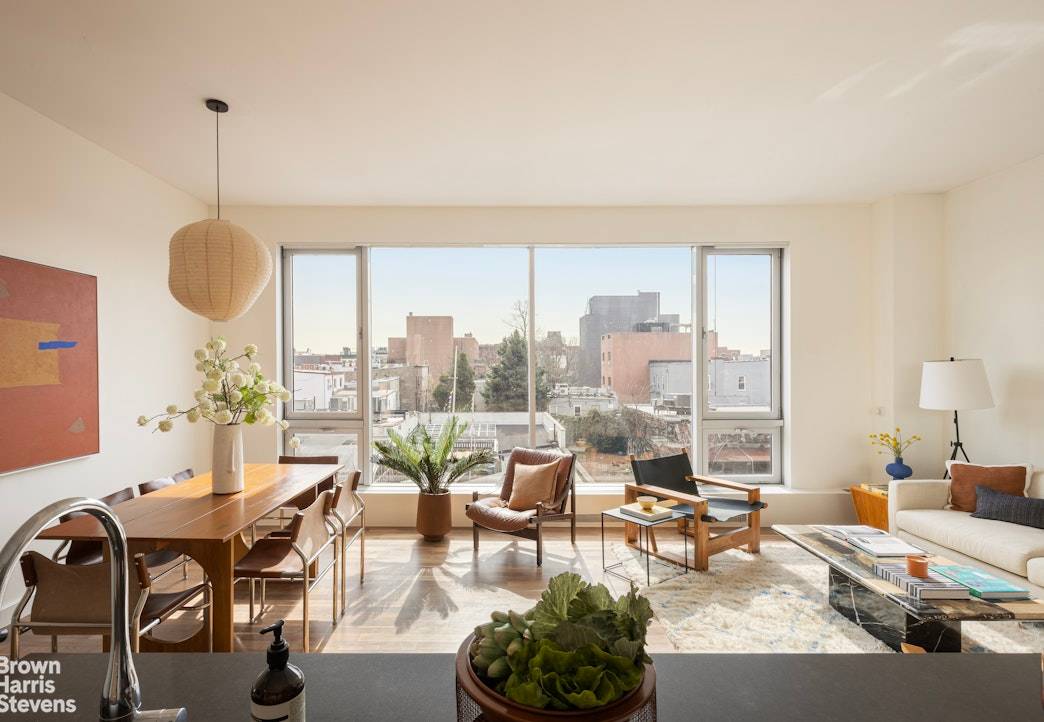 SPACIOUS, SUN SOAKED 2 BEDROOM CONDO IN THE HEART OF WILLIAMSBURG WITH PRIVATE BALCONY.