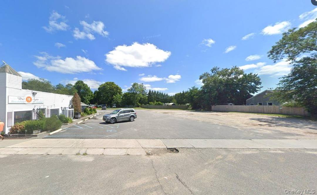 Prime 0. 99 acre lot with excellent frontage on Montauk Highway in East Quogue.