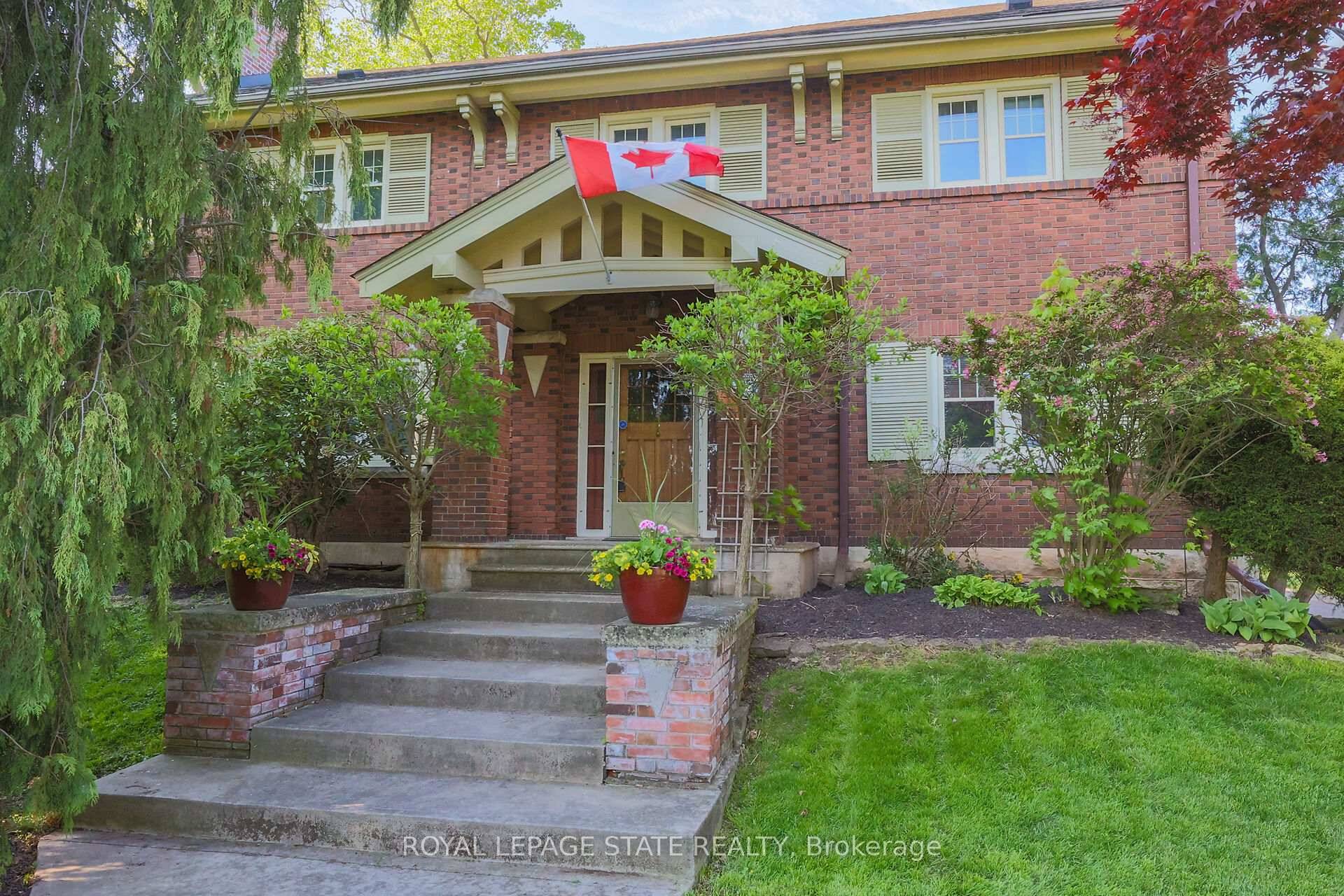 WELCOME TO ONE OF GRIMSBY'S MOST ICONIC HOMES WITH 2150 SQUARE FOOT 2 STOREY SHOP an extraordinary residence set on a spectacular 128 x 230 foot lot with direct access ...