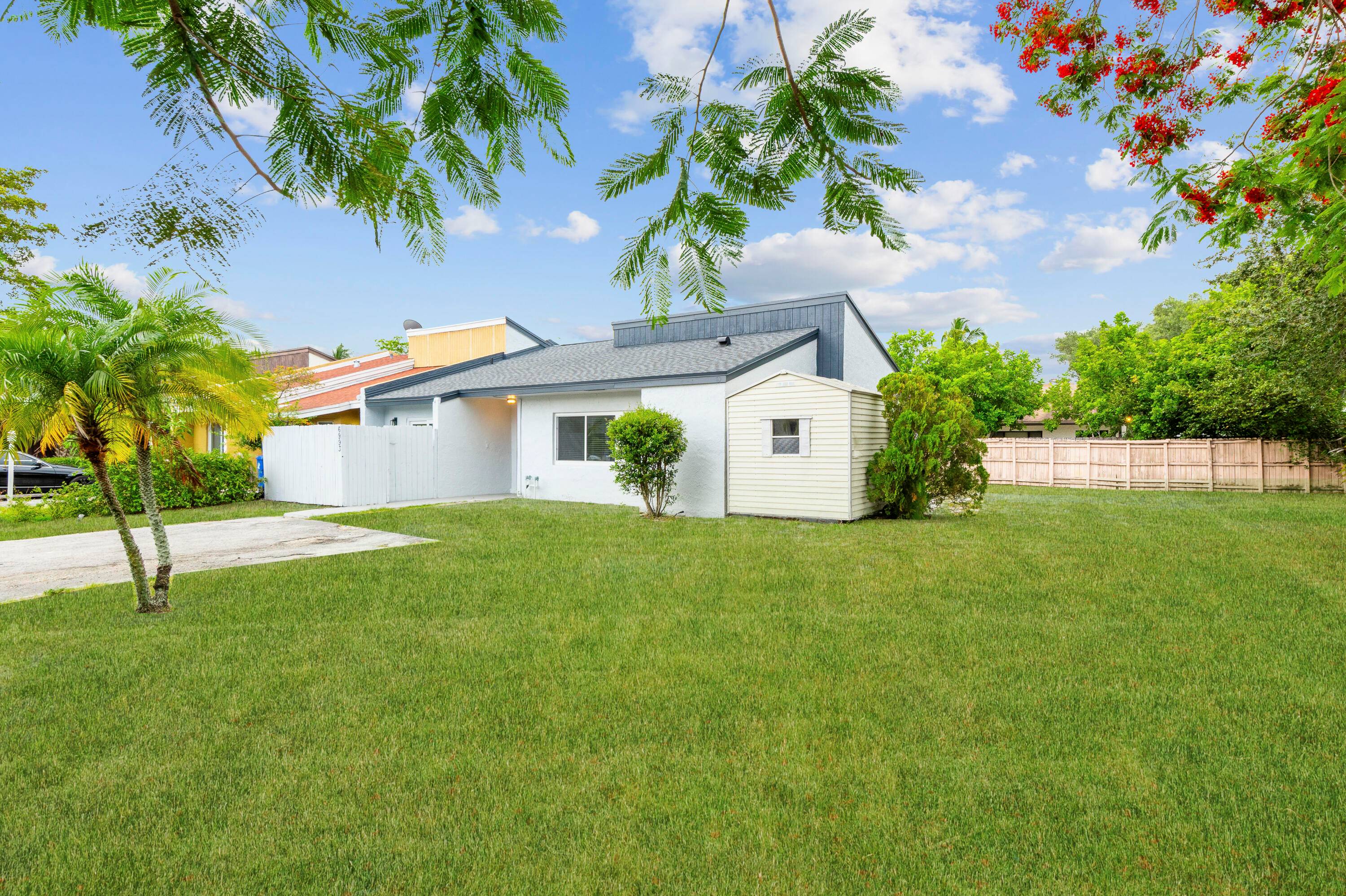This beauty has it all ! Discover this FULLY Renovated Top to Bottom 3 bedroom, 2 bath corner villa with private fenced courtyard located in Fort Lauderdale.