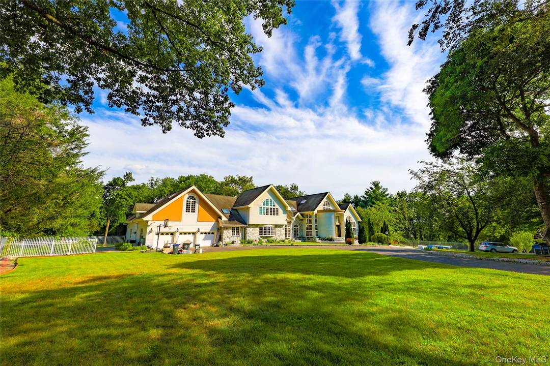 Private backyard with large patio, fully locked and secured front yard with newly installed steel fences surrounded by evergreen trees with automatic gates controlled by phones and Alexa, brand new ...