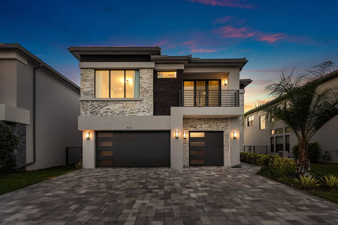 Welcome to 8124 Crystal Downs Avenue, a fully customized Honolulu model nestled within the exclusive, gated enclave of Lotus Palm, one of Boca Raton's most sought after luxury communities.