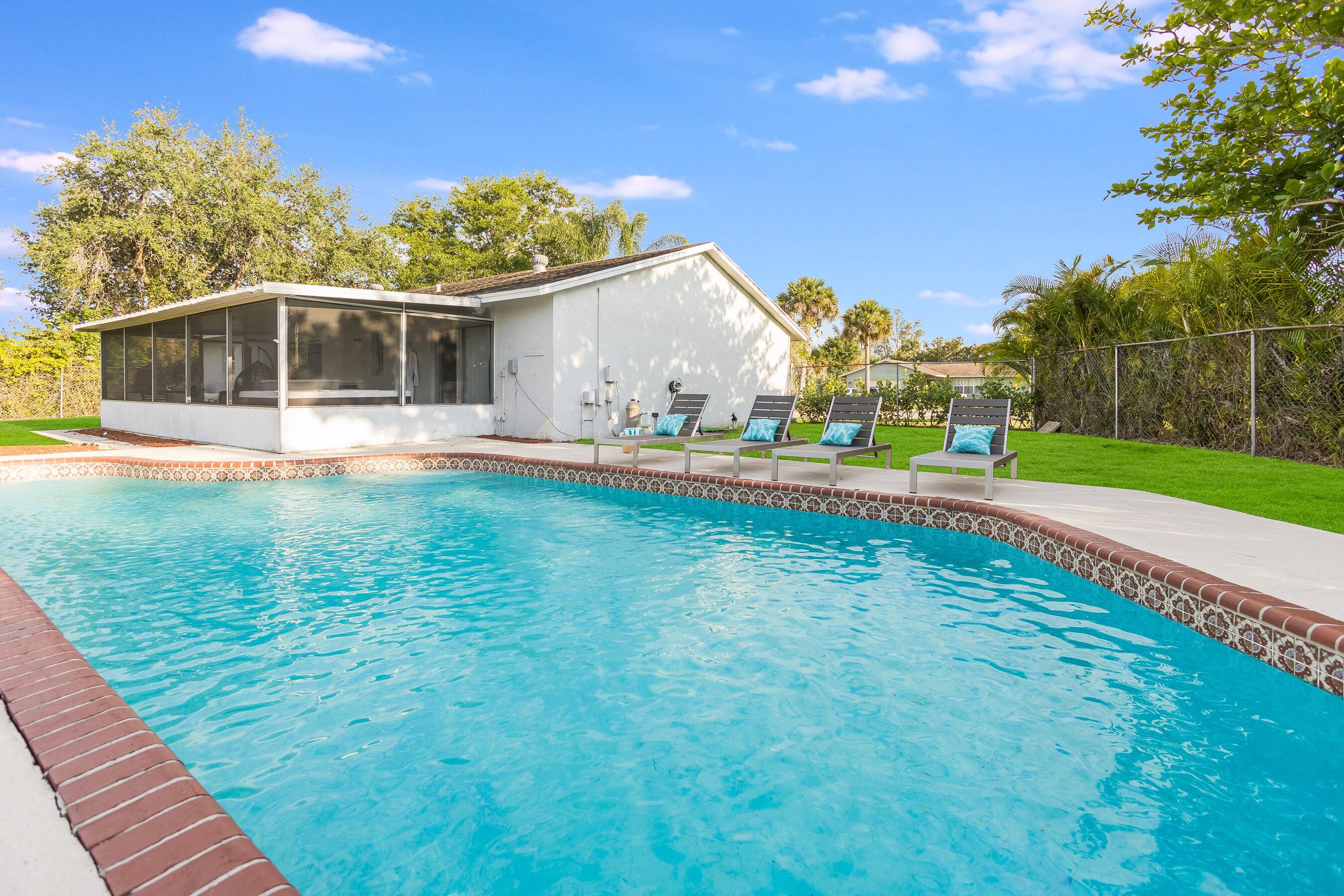 This home in The Willows, Royal Palm Beach, offers peace and serenity at every turn.