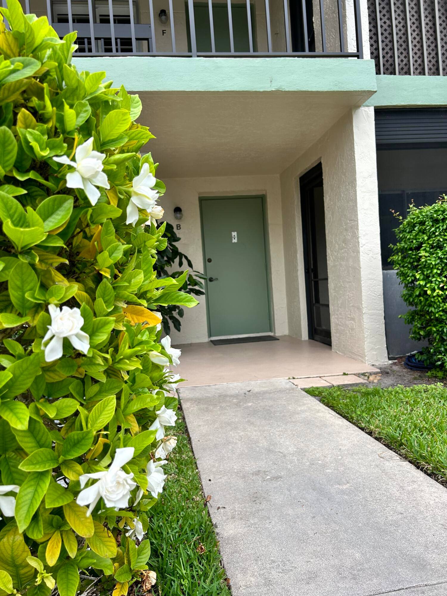 Two bedroom two bath ground floor condo with covered front patio.