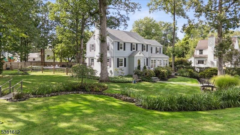 Welcome to this elegant Colonial, perfectly sited on a picturesque corner lot in one of Summit's most desirable neighborhoods.