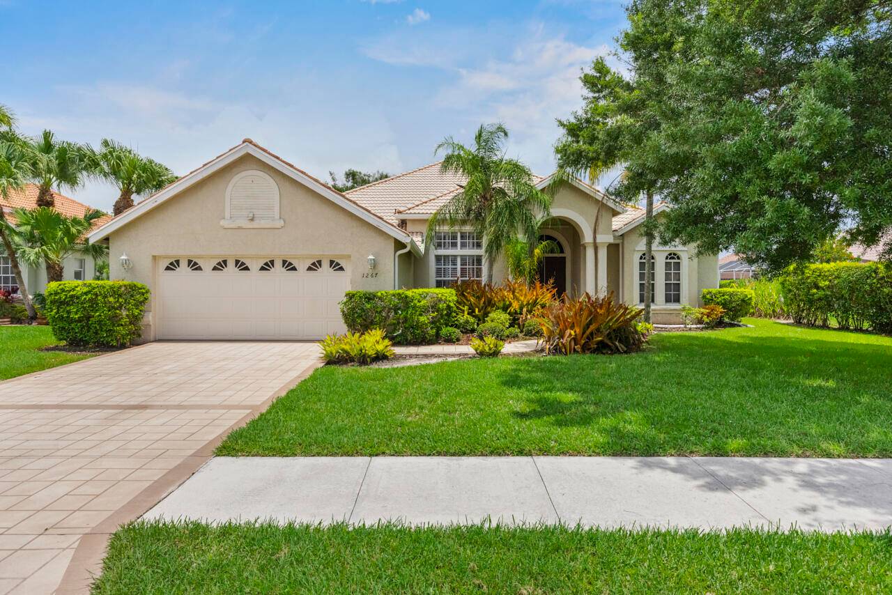 Spacious 4BR 3BA pool home with water views and two fireplaces one in the main living area and another in the primary suite.