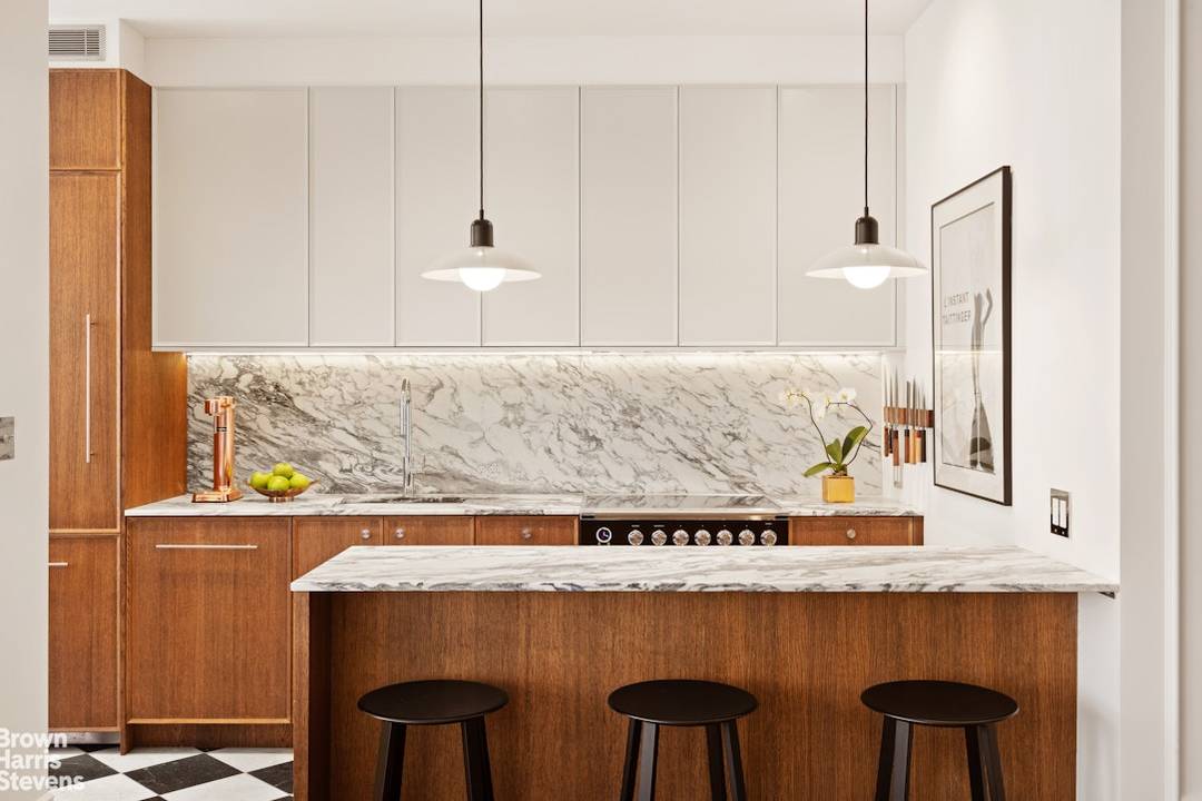 A corner two bedroom of rare finish, tailored to the most discerning buyer.