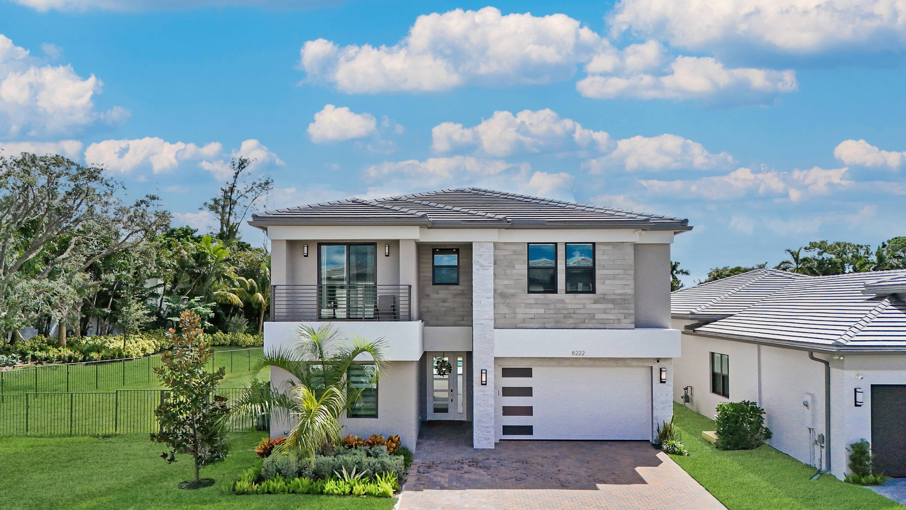Stunning 5BR 7BA Polynesian model in elite Lotus Palm, built in 2024 on an oversized corner cul de sac lot with no neighbor on one side.
