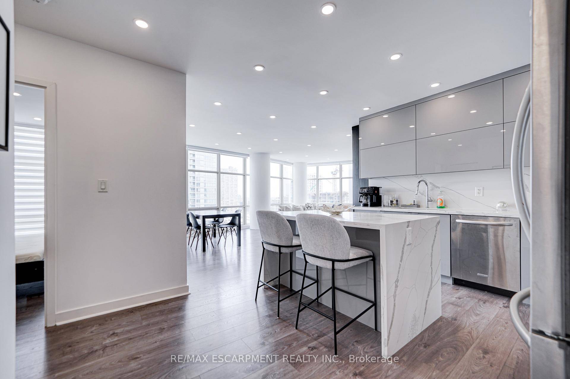 Stunning, recently renovated 2 1 bedroom, 2 bath condo in the heart of downtown Toronto.