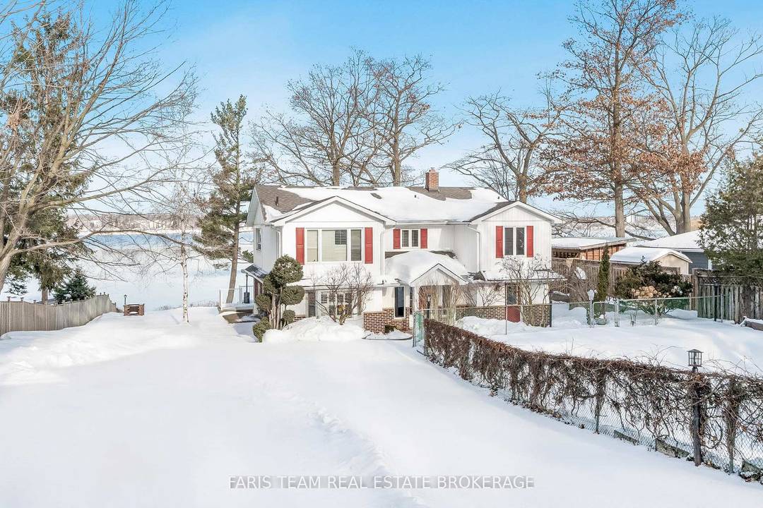 Top 5 Reasons You Will Love This Home 1 Welcome to an exceptional waterfront retreat, boasting over 91' of pristine sandy shoreline and a steel retaining wall, where sunsets paint ...