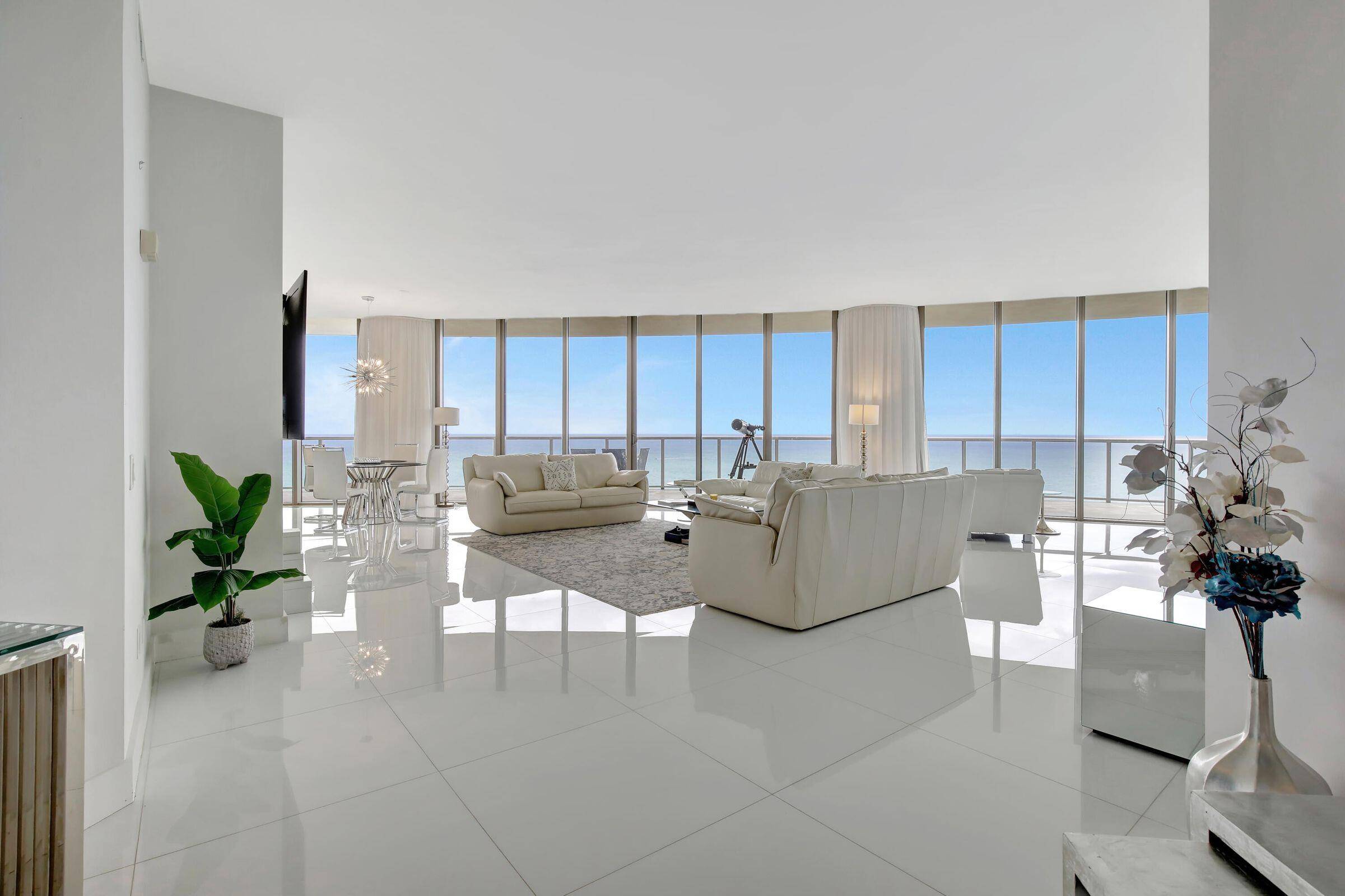 Welcome to PH888, a luxurious residence on the 27th floor with unobstructed panoramic views of the Atlantic Ocean.