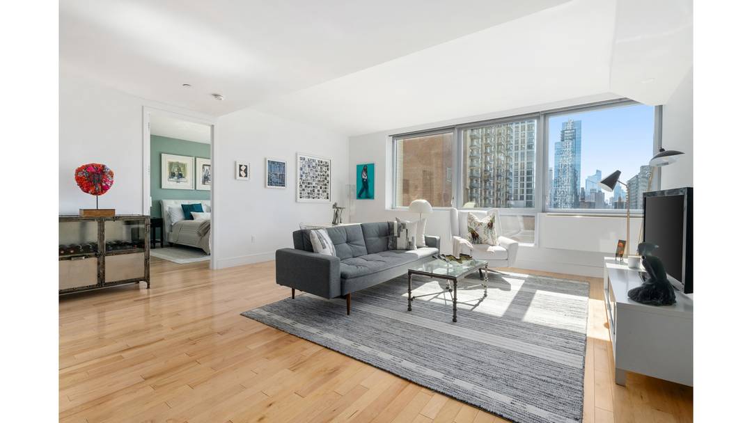 Bathed in natural light, this south facing split two bedroom, two bath residence enjoys open city views and a thoughtfully balanced layout designed for both comfortable living and effortless entertaining.