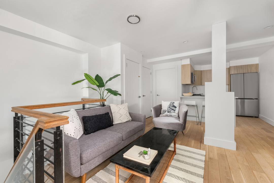 OPEN HOUSE IS BY APPOINTMENT ONLY Massive duplex with private garden, patio, and a huge storage room.