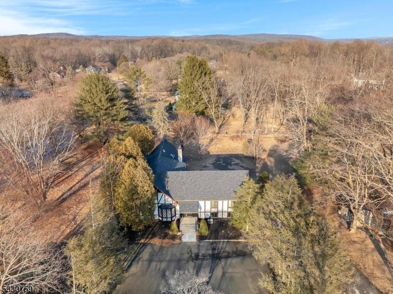 Spacious renovated home with flexible floor plan and very large rooms is situated on the highly desirable Mendham side of Chester Twp.