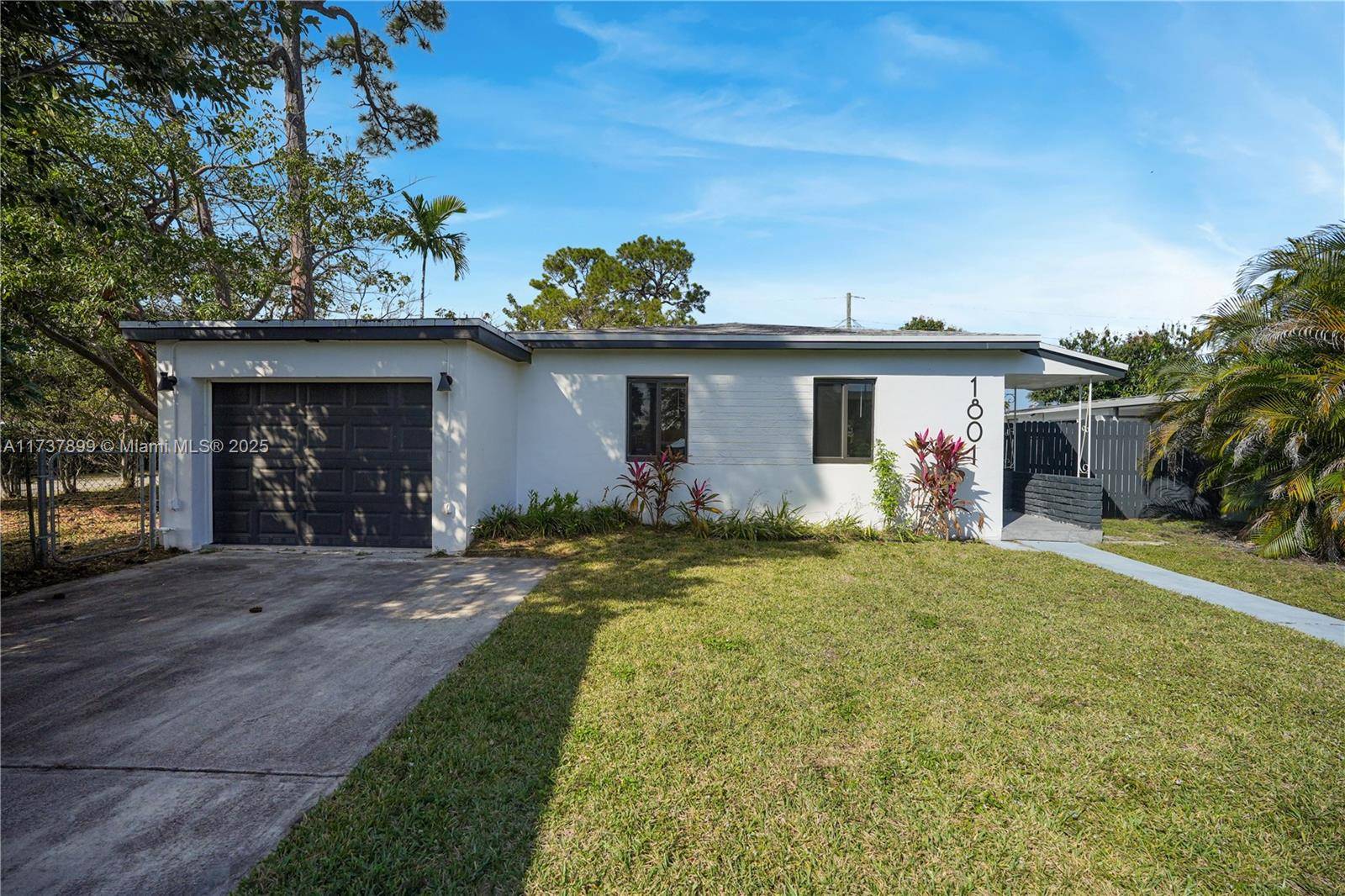 Beautifully renovated home in North Miami Beach on a spacious 7, 700 sq ft corner lot.