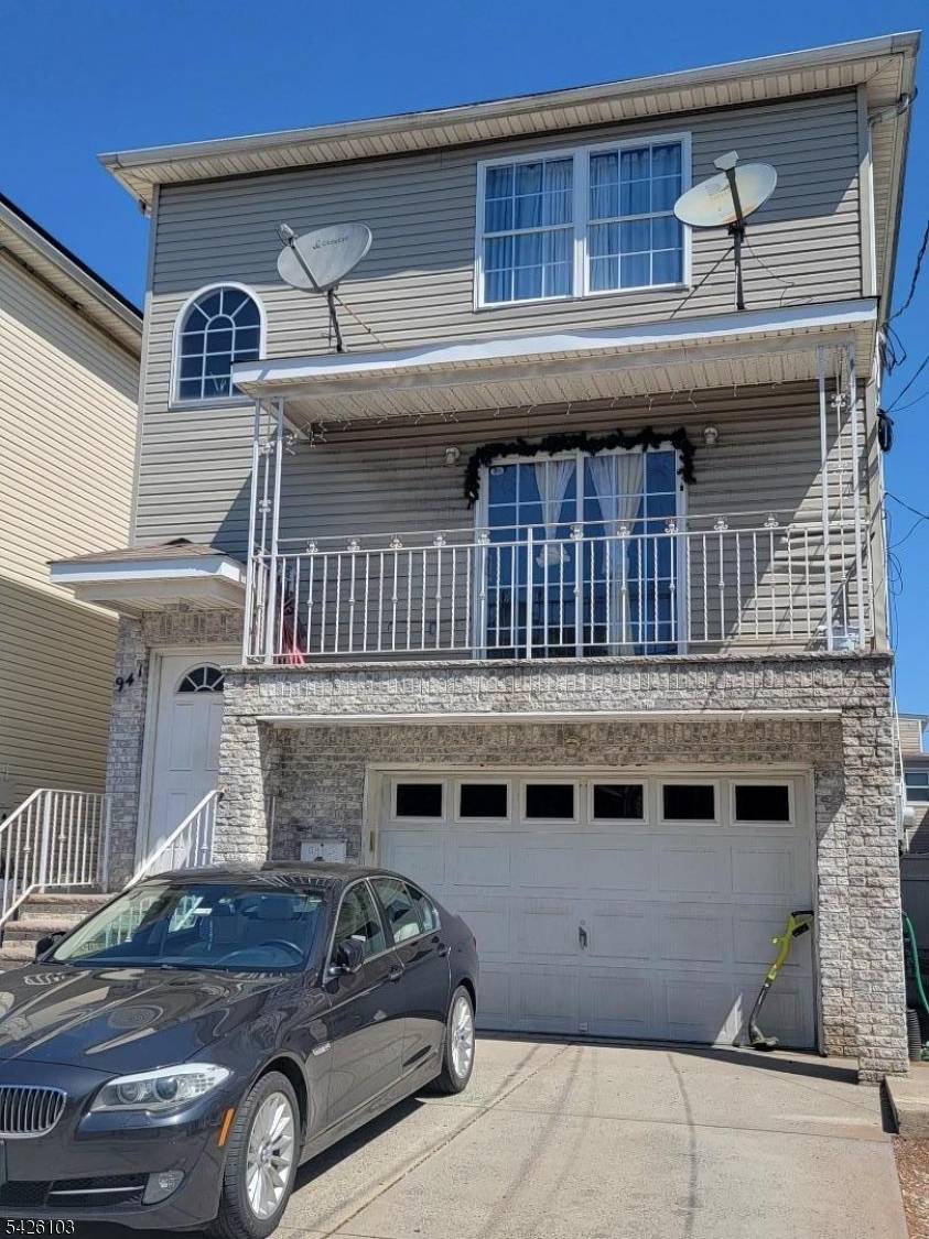 Beautiful two family home in good condition, featuring three bedrooms two bathrooms laundry area and central AC in each unit.