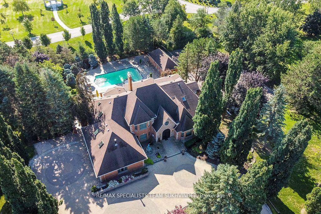 Welcome to 12 Edgeforest Drive an exceptional custom built estate nestled on a private, gated, over 2 acre lot in one of Brampton's most prestigious enclaves.