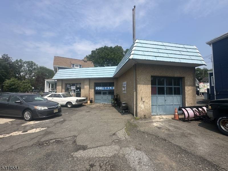 Exceptional opportunity to own a high visibility commercial Auto Repair shop on a prime corner lot in South Orange.