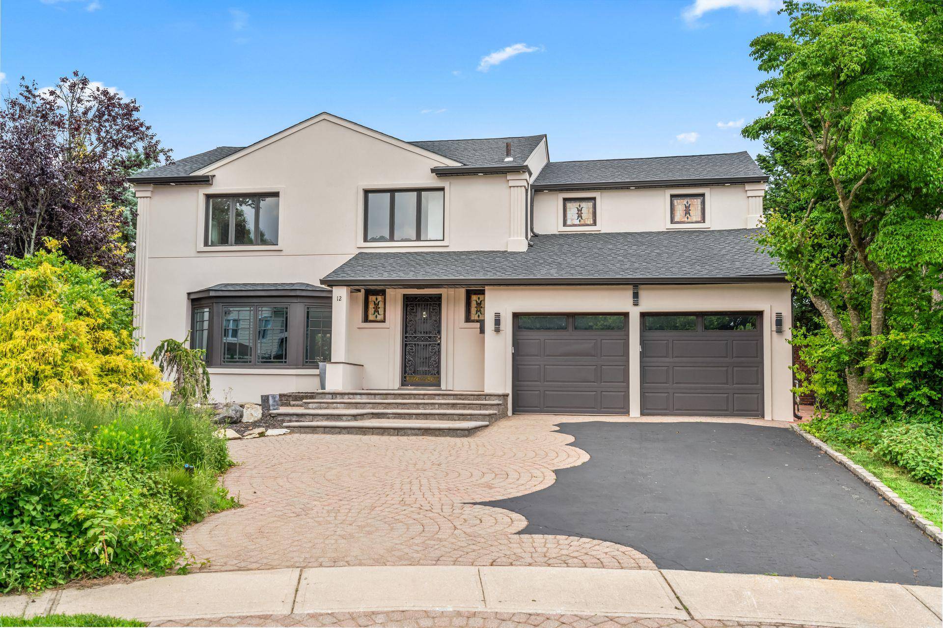 Look no further this beautifully renovated gem in the desirable Suburban Woods section of Manhasset Hills offers the best of luxury living.