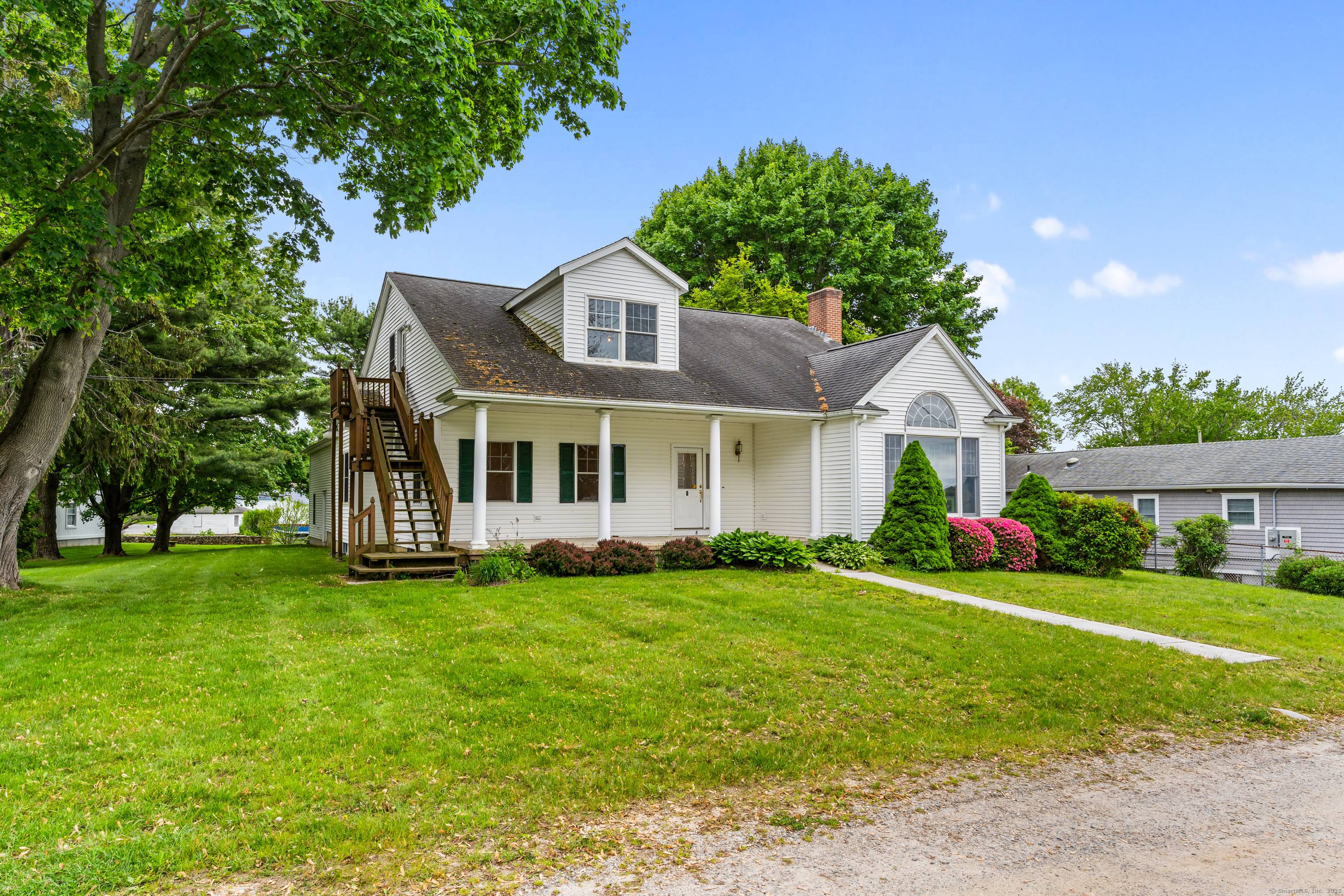 Beautiful one owner custom built home in ready to move in pristine condition, located in Mago Point, Waterford, CT, looking up the Niantic River.