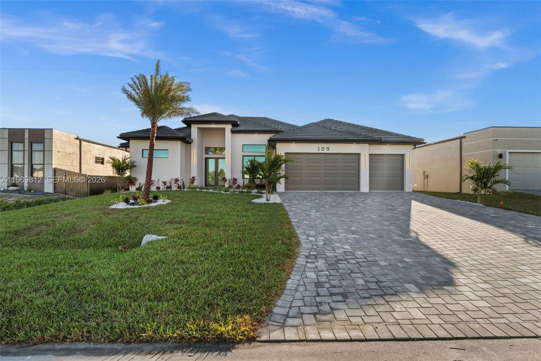 Motivated Seller Beautifully designed modern residence offering 4 BEDROOMS and 3 BATHROOMS with a bright, expansive layout that feels open and seamlessly connected throughout.