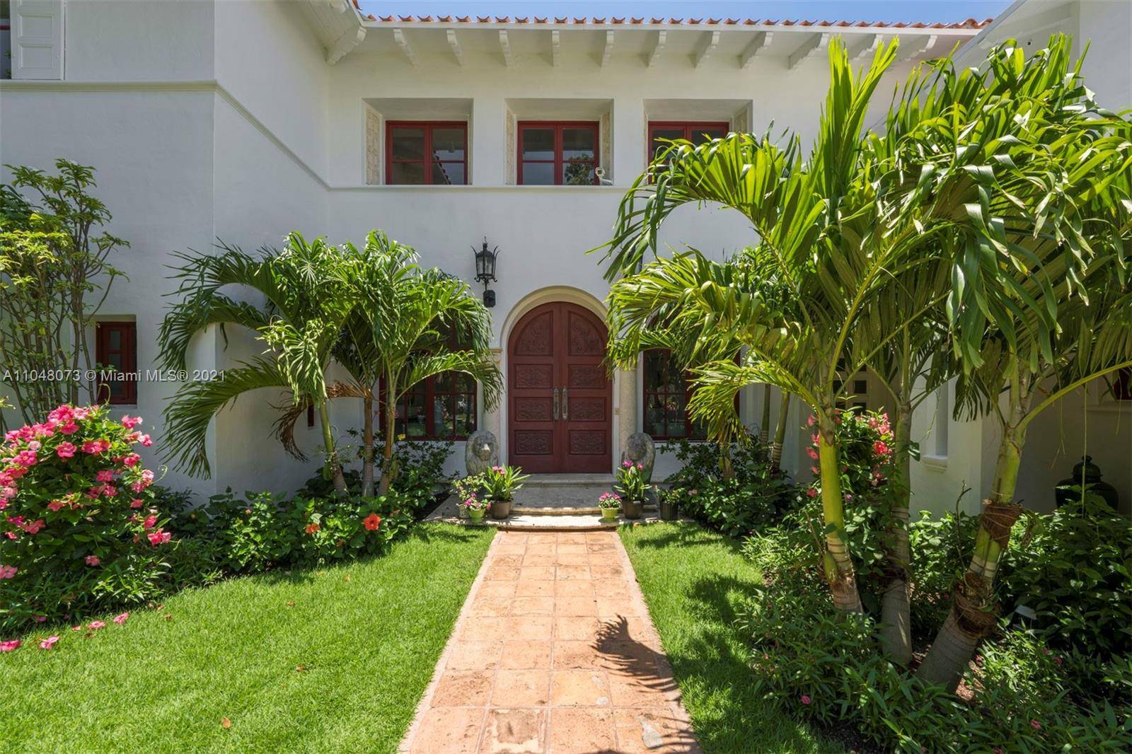 Enjoy living in this exquisite waterfront historic estate on prestigious Pine Tree Dr.