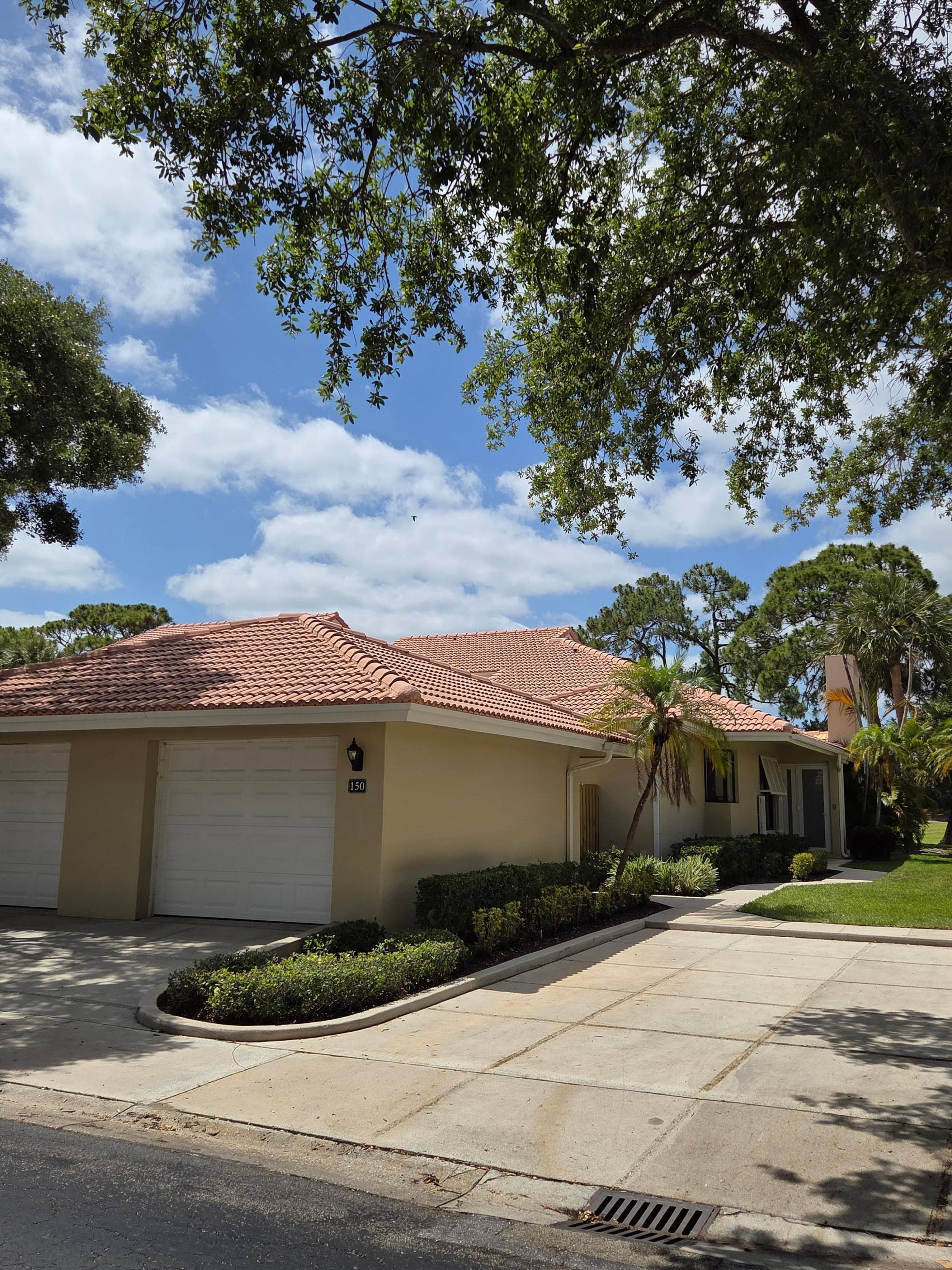 Fabulous and most desired 1 level end unit patio home with 2 BR, 2BA, 1 car garage in PGA National Resort model c with outstanding direct panoramic view of Fazio ...